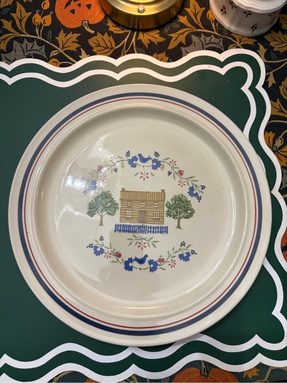 Cream Dinner Plate with Blue and Red Trim and Cottage Motif